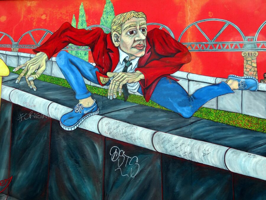 Colourful graffiti art on a section of the Berlin Wall in Germany, showcasing vibrant street art and historical significance.