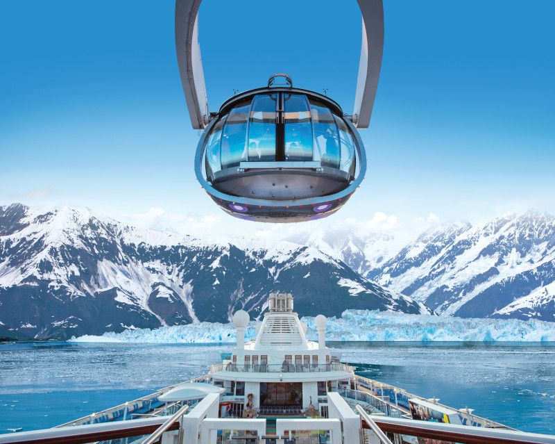 Alaska image RCI Ovation Ship with Alaskan mountains in the foreground
