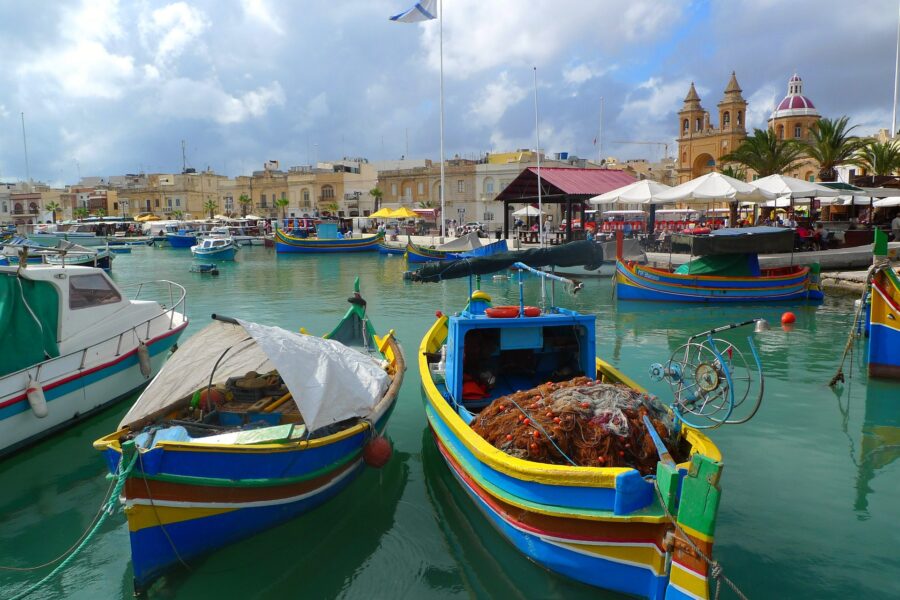 Malta & Gozo Guided Tour. Two Fishing boats in harbour in Mlata