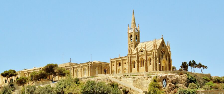 The majestic Basilica of Ta' Pinu in Gozo, Malta, with its distinctive architecture and hilltop setting. A prominent religious landmark.