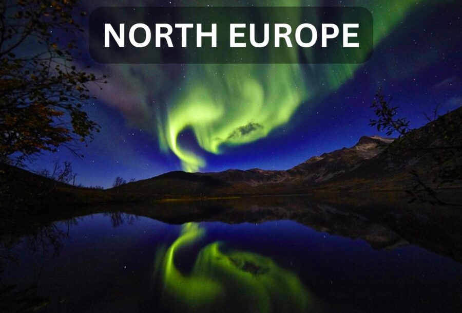 Northern Lights at night as seen off Norway. Image of lights reflected in water