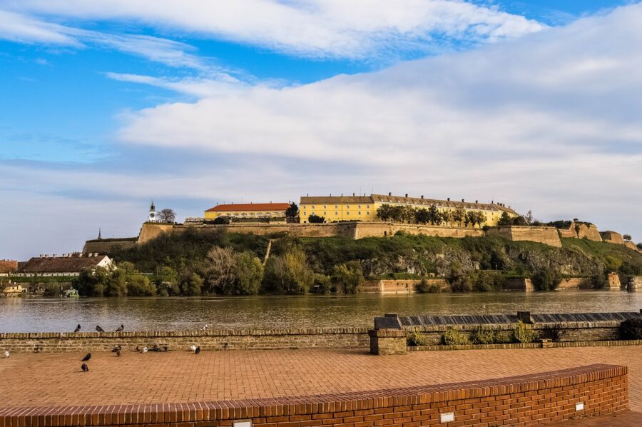 View of the historic Petrovaradin Fortress on a hill above the Danube river in Novi Sad, Serbia, visited on the Crossroads of Culture tour.