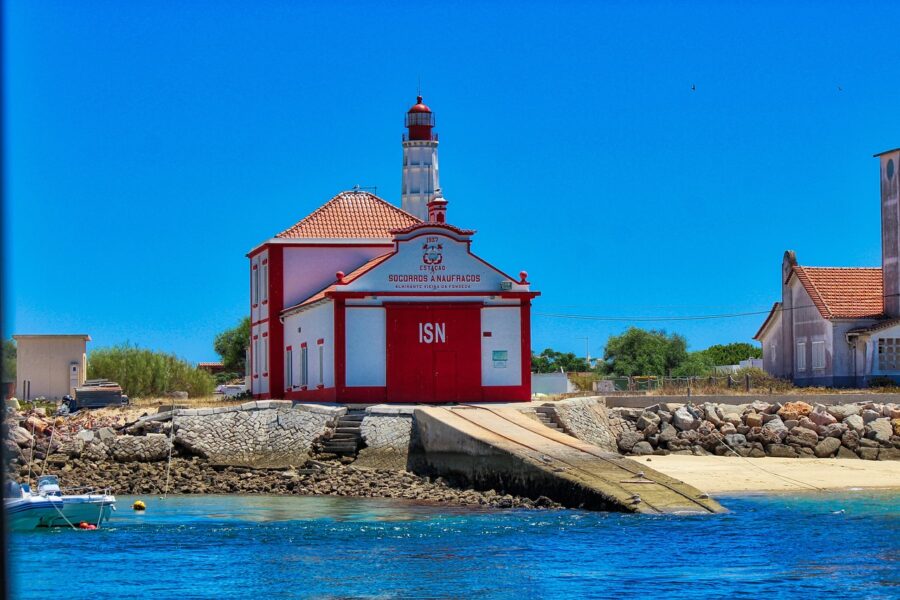 A bright red and white building, serving as a lifeboat station with