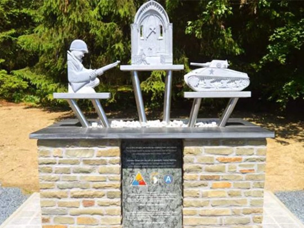 The memorial in Foy, Belgium, depicting a soldier and a tank, dedicated to the US divisions in the Battle of the Bulge.
