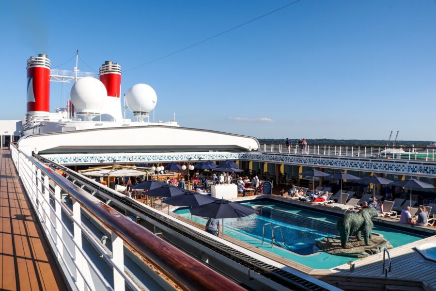 Guests relaxing by the pool deck on the MS Bolette cruise ship