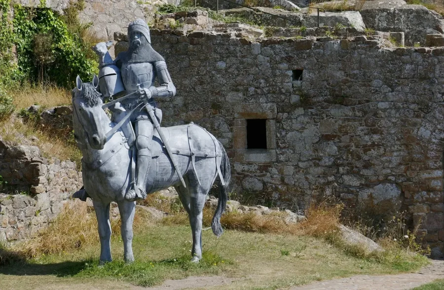 The Perfect Knight statue standing guard at Mont Orgueil Castle overlooking Gorey Harbour in Jersey.