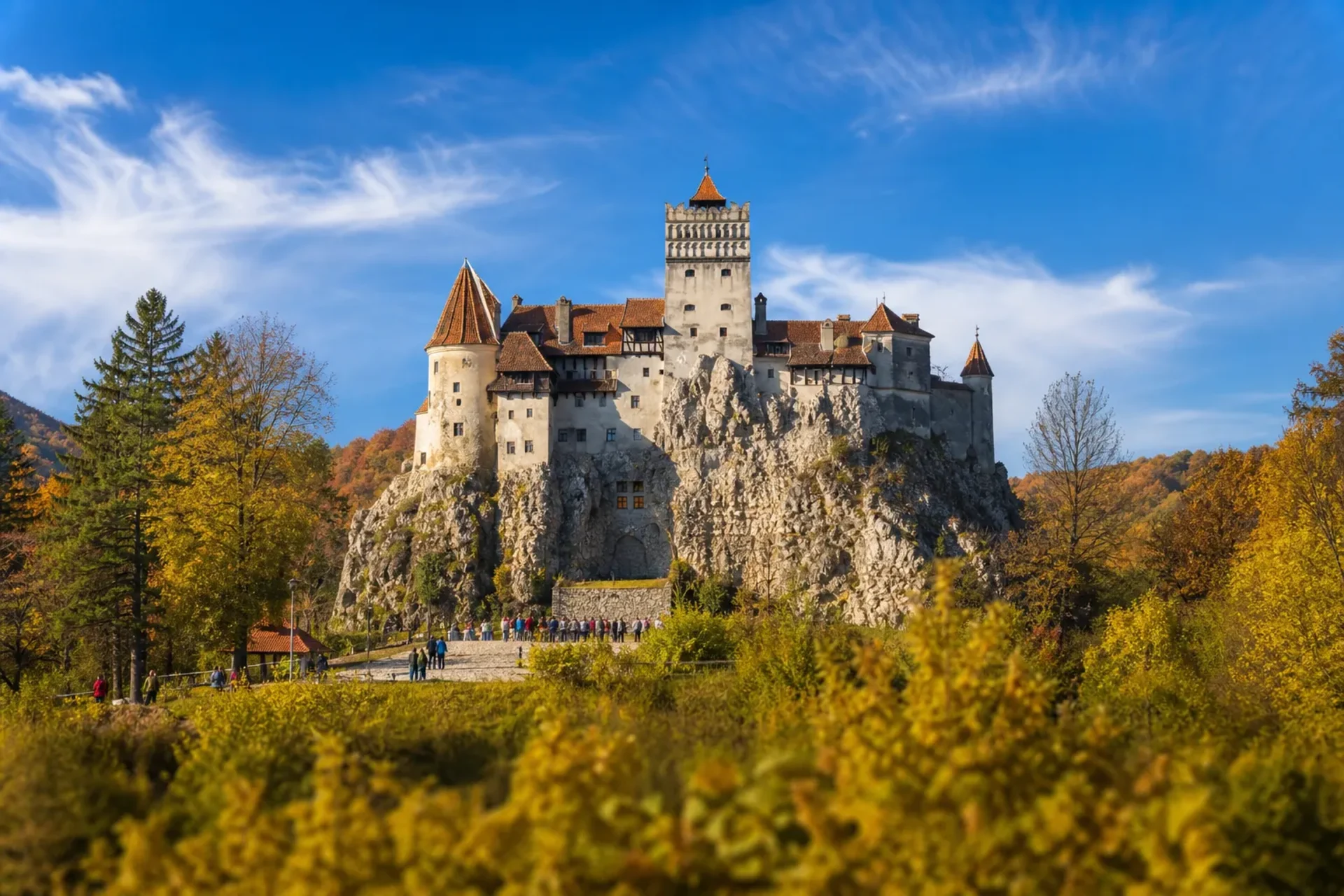 Romania-The historic Bran Castle perched on a cliffside during a Halloween in Transylvania escorted tour.