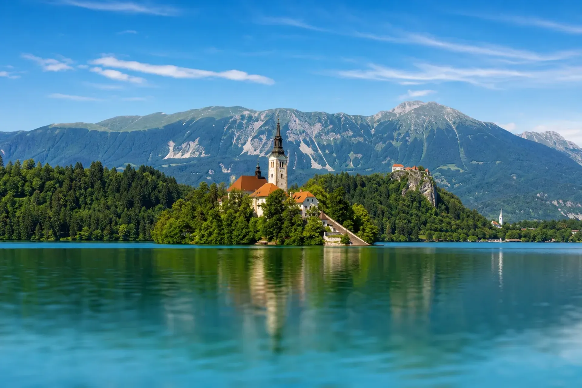 Slovenia & Croatia-A panoramic view of the island church at Lake Bled, a highlight of our Slovenia Zagreb tour.