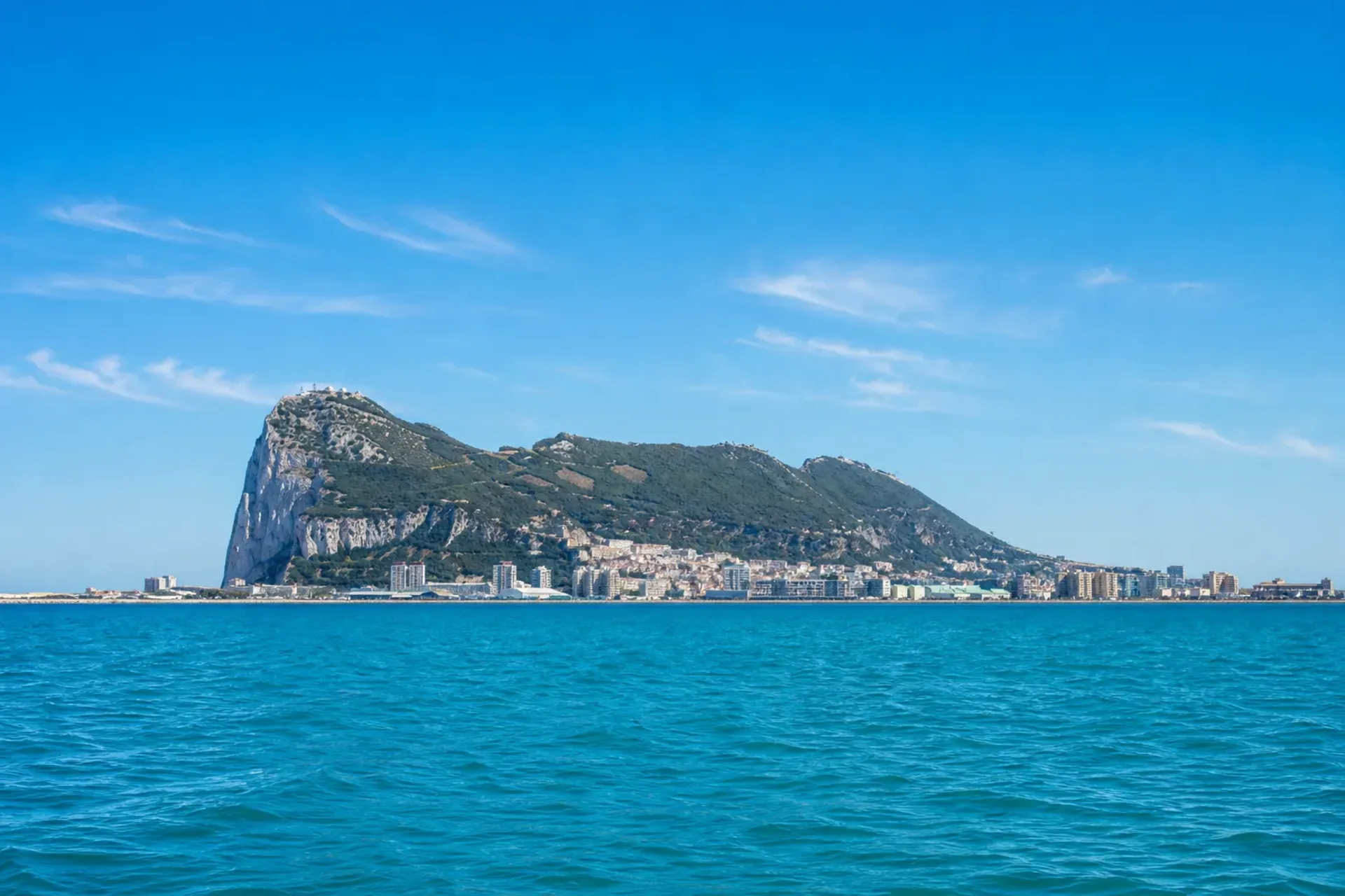 Spain and USA-A sunny view of the Rock of Gibraltar from the sea during a Barcelona to Florida cruise.