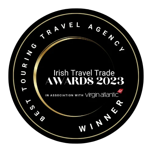 Circular award badge: 'Best Touring Travel Agency Winner' at the Irish Travel Trade Awards 2023, in association with Virgin Atlantic.