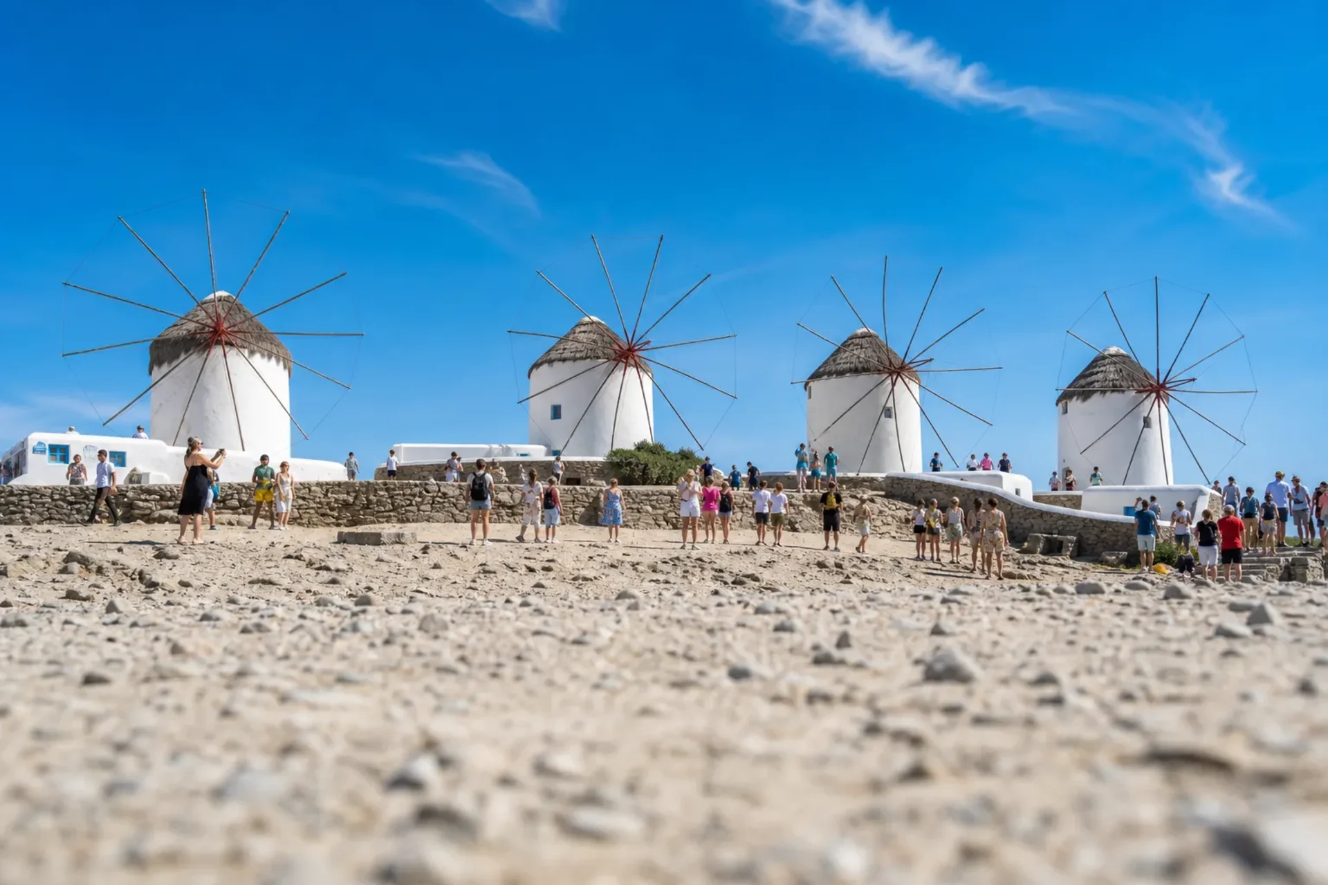 Greece and Turkey-The iconic white windmills of Mykonos under a blue sky during a Greece Turkey Mykonos cruise.