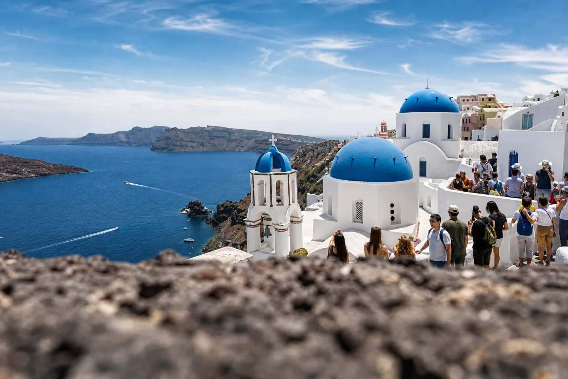 Greece & Turkey-Iconic blue-domed churches in Santorini seen during a Greece Turkey cruise.