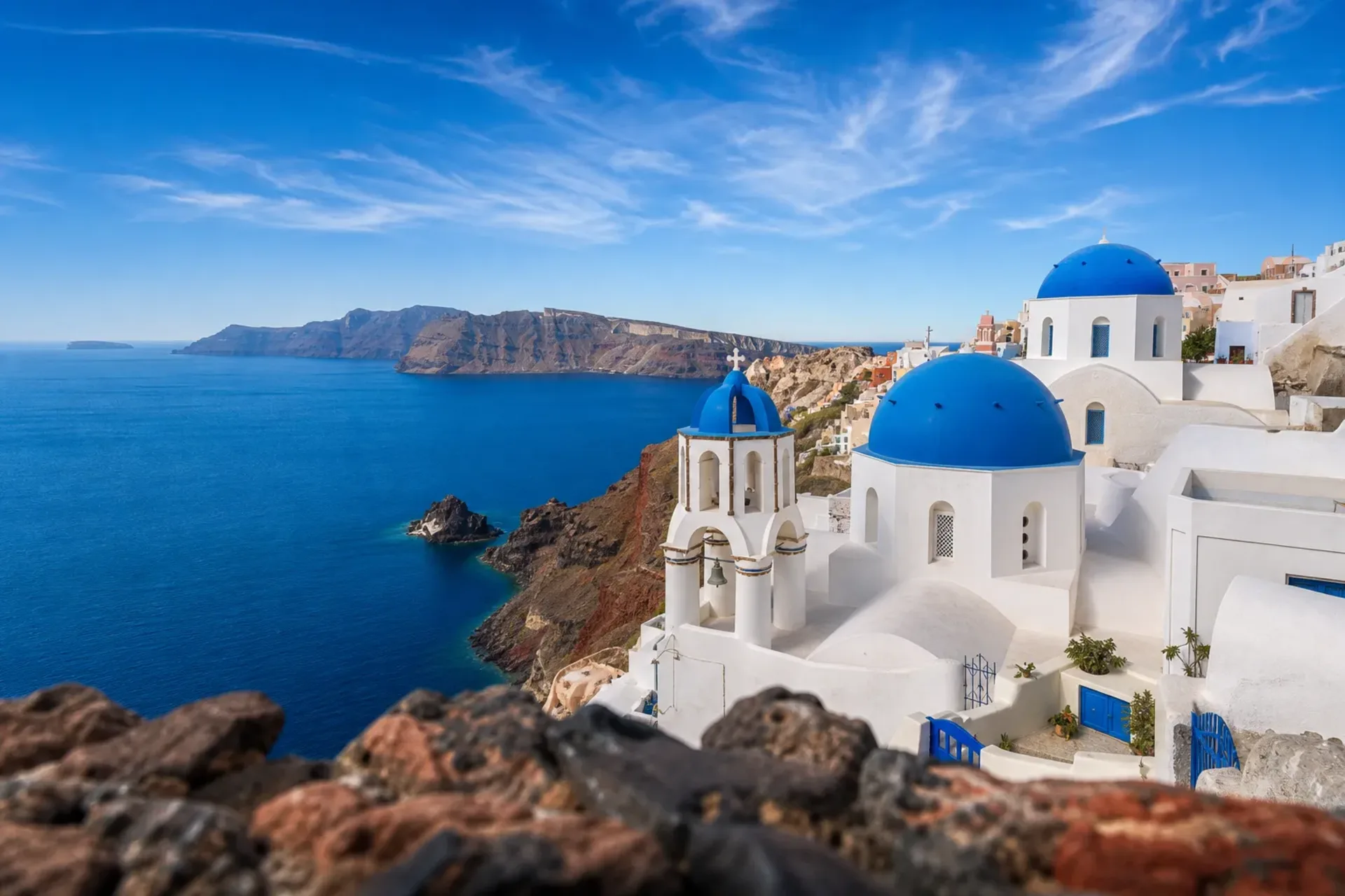 Greece & Turkey-Iconic blue-domed churches in Santorini during a Greek Isles Mykonos cruise.
