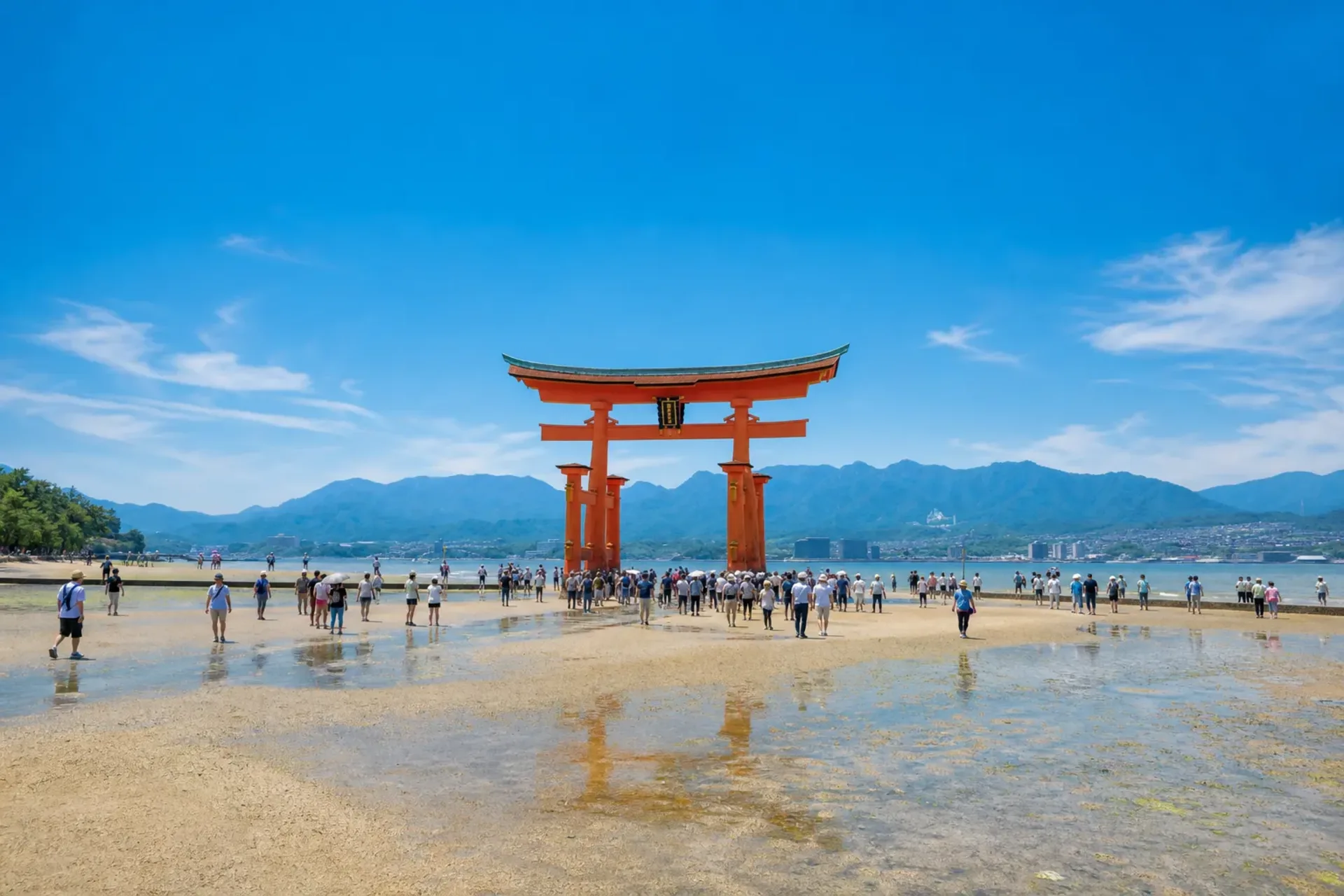 Japan-A traditional red Torii gate at the waterfront during a Japan night cruise stop.