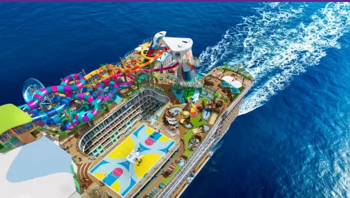Royal Caribbean Legend of the Seas cruise ship top deck with water slides, family activities and ocean wake viewed from above