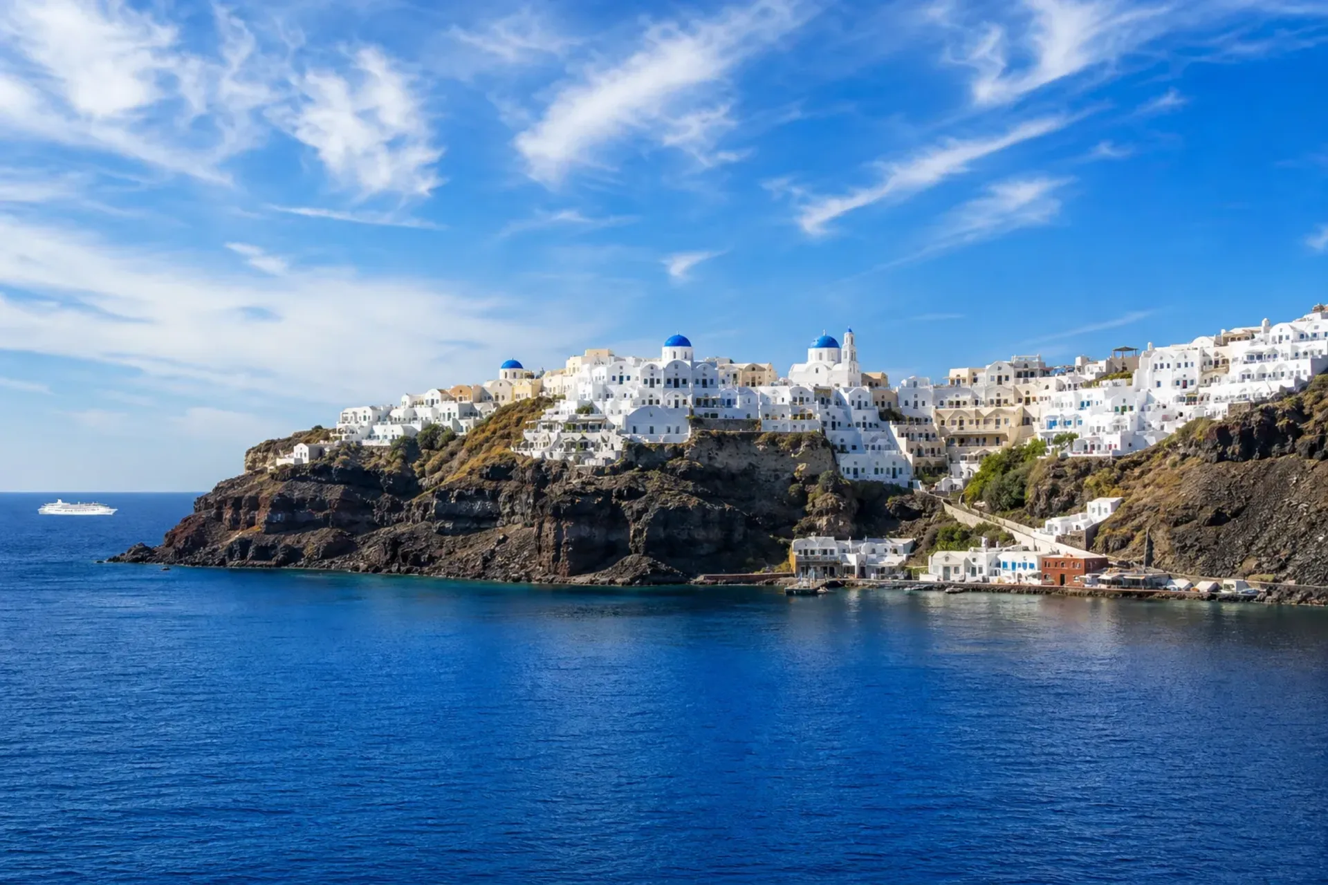 Greece and Turkey-The stunning cliffs and white buildings of Santorini seen during a five-star Enchanted Greece Turkey cruise.