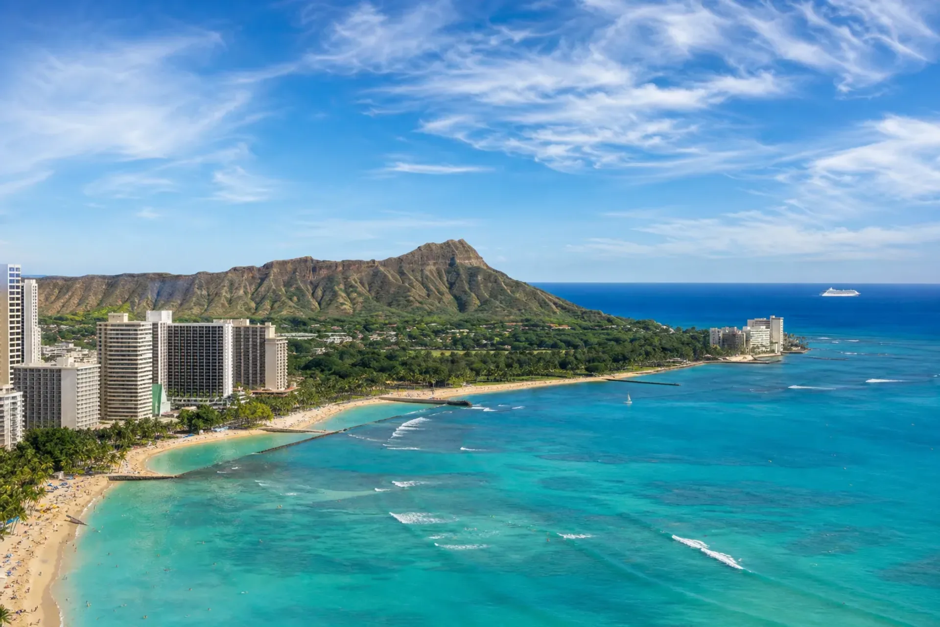 Hawaii & USA-A sunny view of the Hawaii coastline with a ship on the horizon during a Hawaii 16 night cruise.