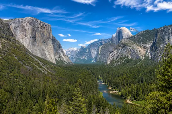 Panoramic mid-day view of Yosemite Valley, California, showcasing the incredible wilderness experienced on our Americas escorted tours.