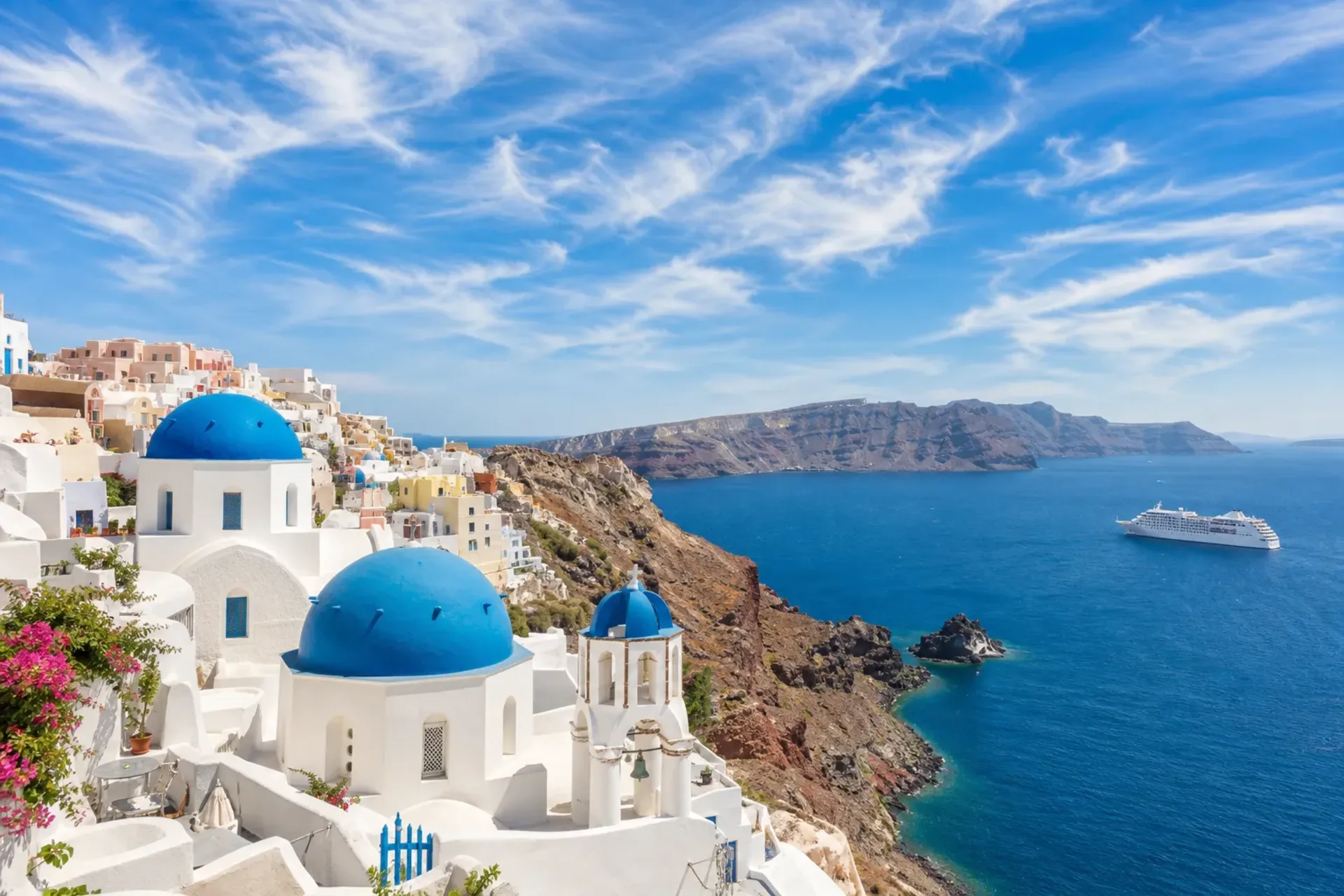 Greece-The sun-drenched coastline of Santorini seen during an Athens Barcelona cruise.