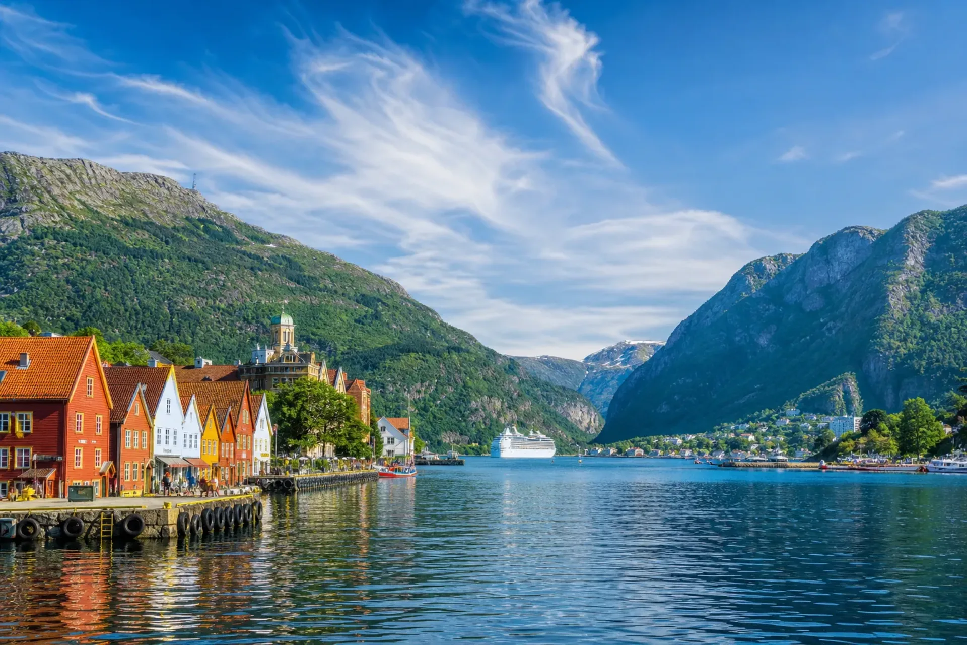 Norway-A generic passenger ship on a calm blue fjord during a Norwegian Fjords cruise.