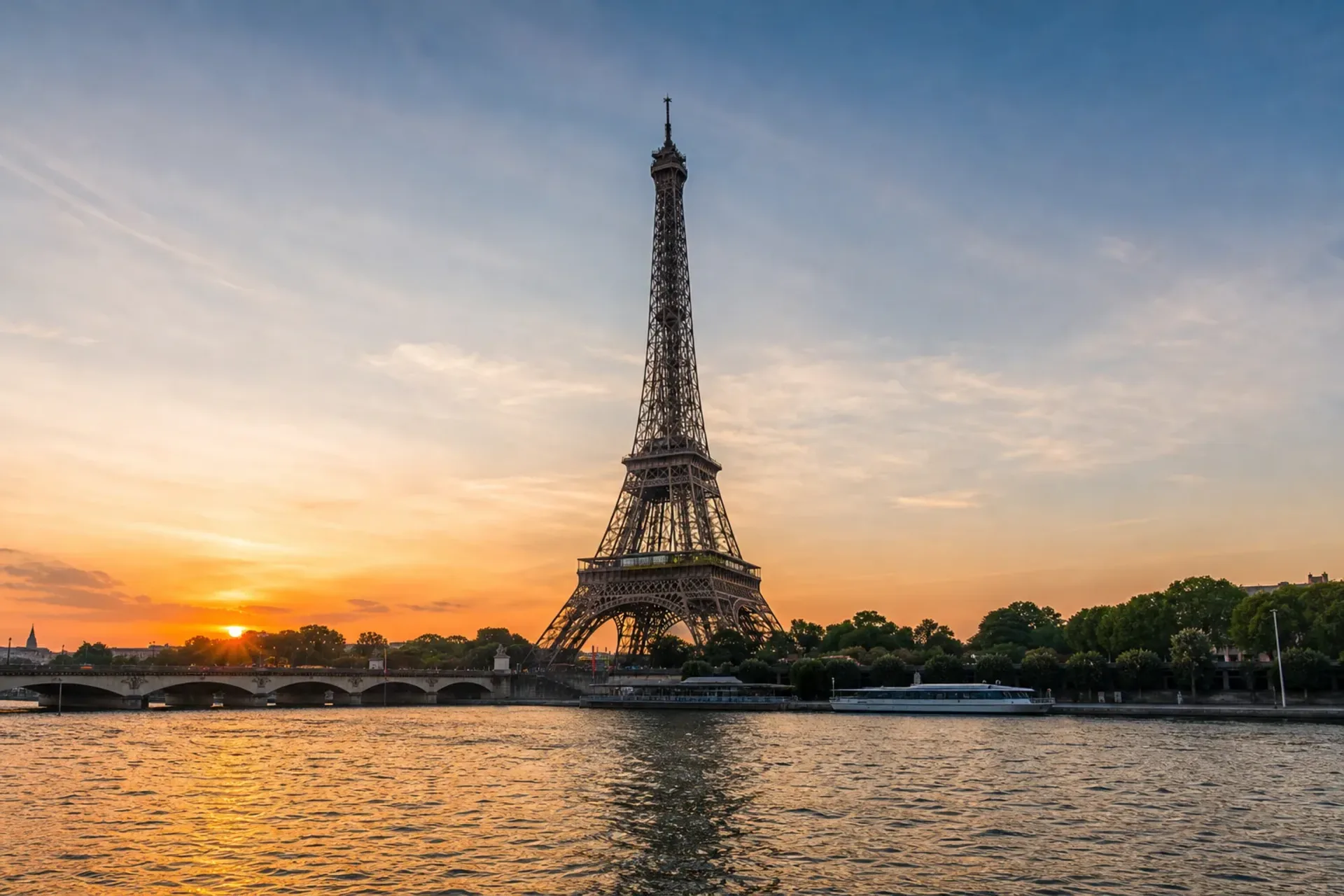 France-The Eiffel Tower viewed from a Paris river cruise boat at sunset.
